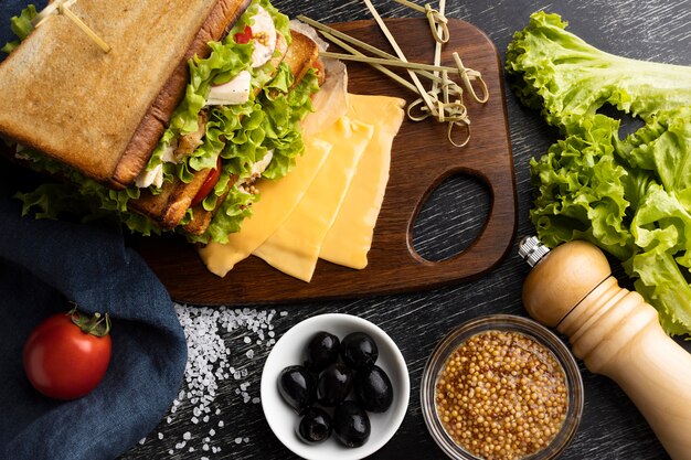 Top view of of toast sandwich with salad and tomatoes