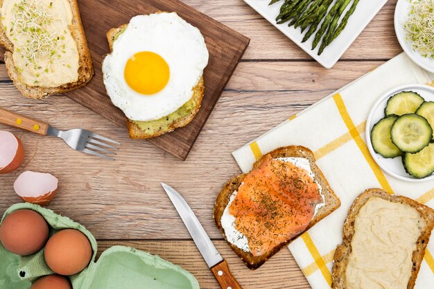 Top view of toast with egg and cucumber