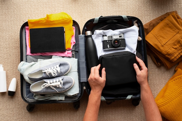 Top view toilet bag and baggage still life