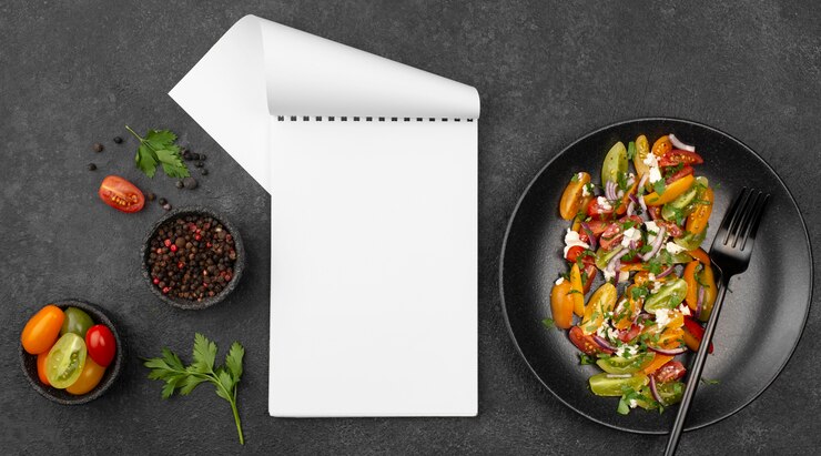 Free Photo top view tomato salad with feta cheese, rucola and blank notepad