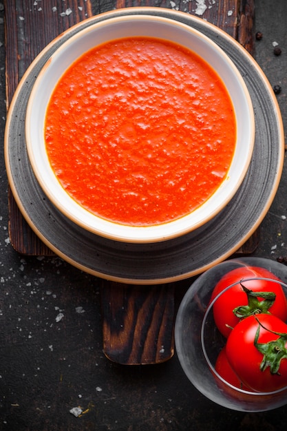 Top view tomato soup with tomatoes in plate