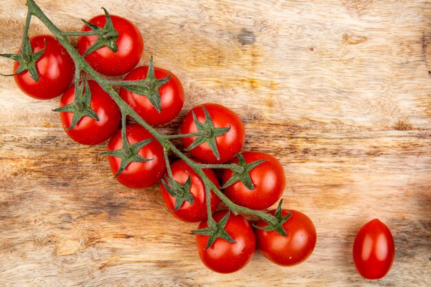 Top view of tomatoes on cutting board as surface