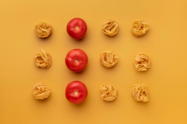 top view tomatoes and pasta arrangement