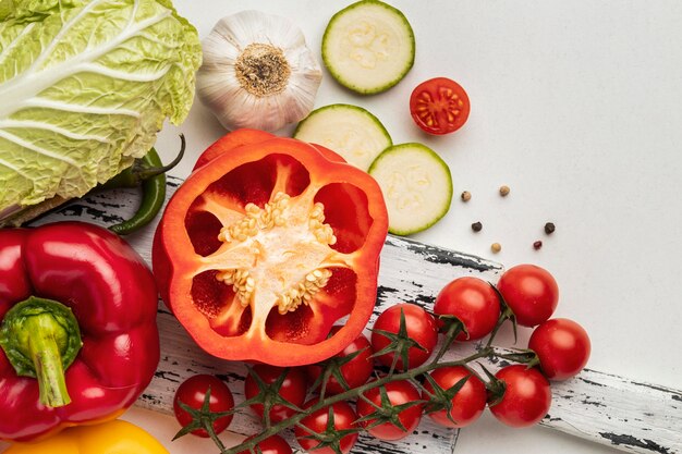 Top view of tomatoes with bell pepper and garlic