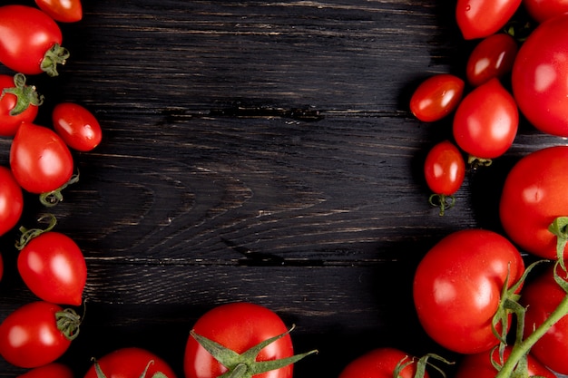 Top view of tomatoes on wood with copy space