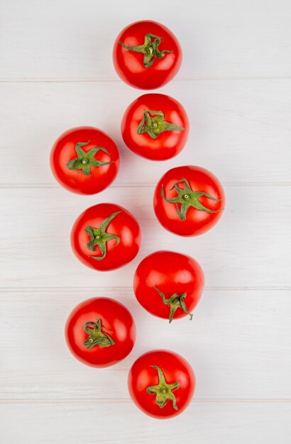 Top view of tomatoes on wooden surface