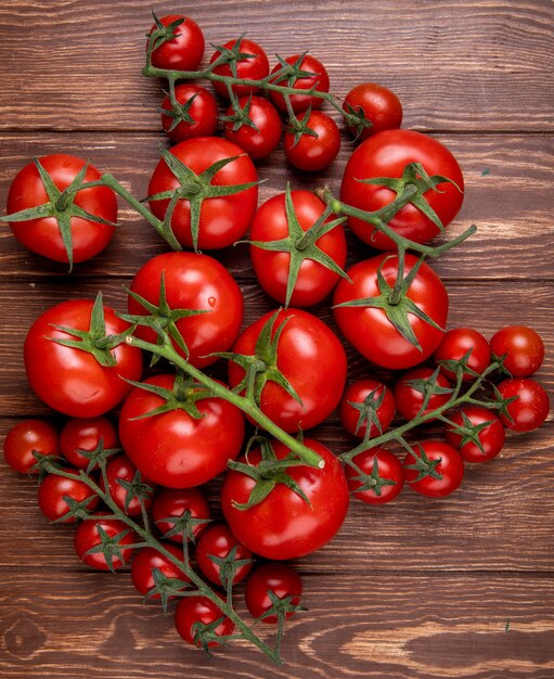 Top view of tomatoes on wooden surface