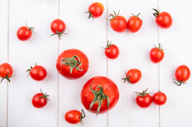 Top view of tomatoes on wooden surface