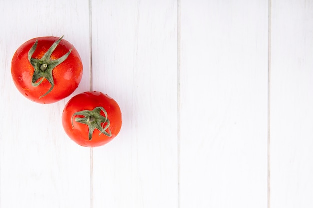 Top view of tomatoes on wooden surface