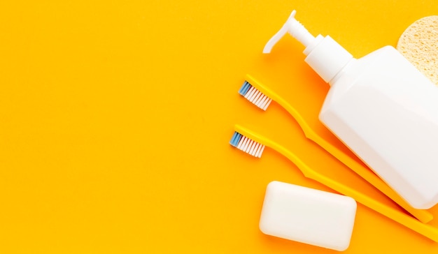 Top view toothbrushes and soap with copy space