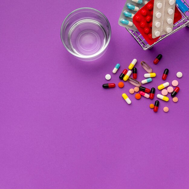 Top view toy cart with clock and pills beside