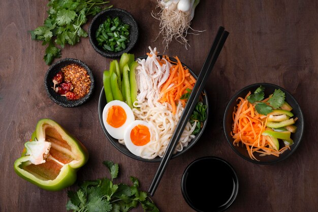 Top view of traditional asian meal with vegetables and eggs