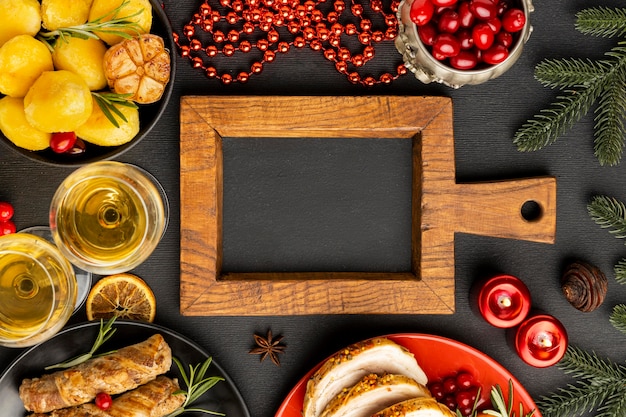 Top view traditional christmas cuisine arrangement with chalkboard