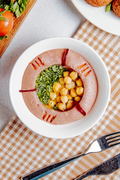 Top view of traditional middle eastern hummus with chickpea and olive oil