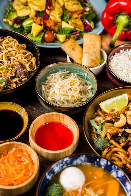 Top view of traditional thai food on a wooden table