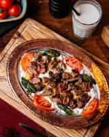 Free photo top view of traditional turkish iskender doner with yogurt on plate