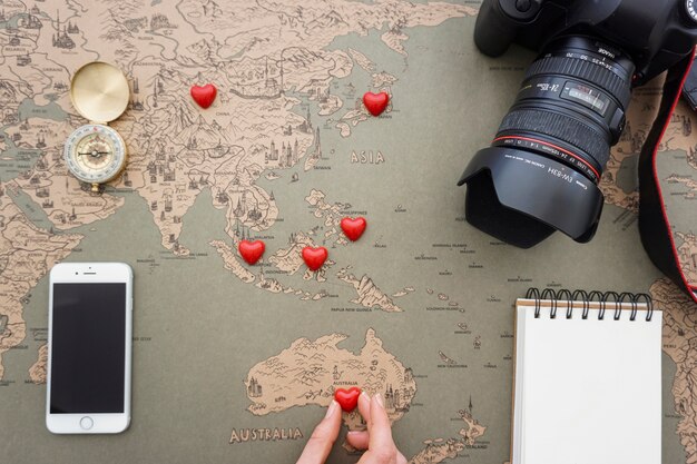 Top view of travel composition and red hearts