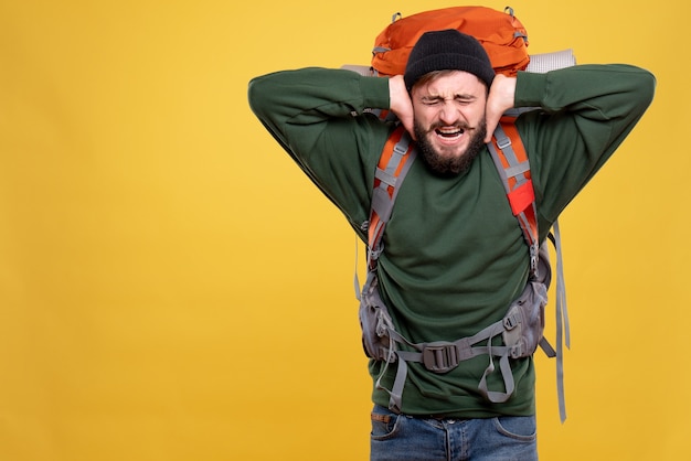 Free photo top view of travel concept with nervous emotional young guy with packpack