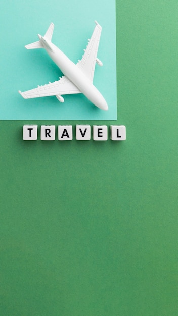 Free photo top view travel concept with white plane