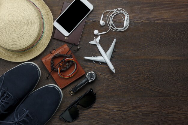 top view travel elements on wooden background