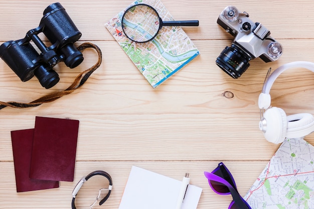 Top view of traveler accessories on wooden surface