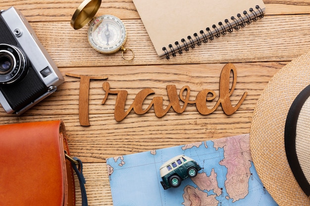 Top view traveling items on wooden background