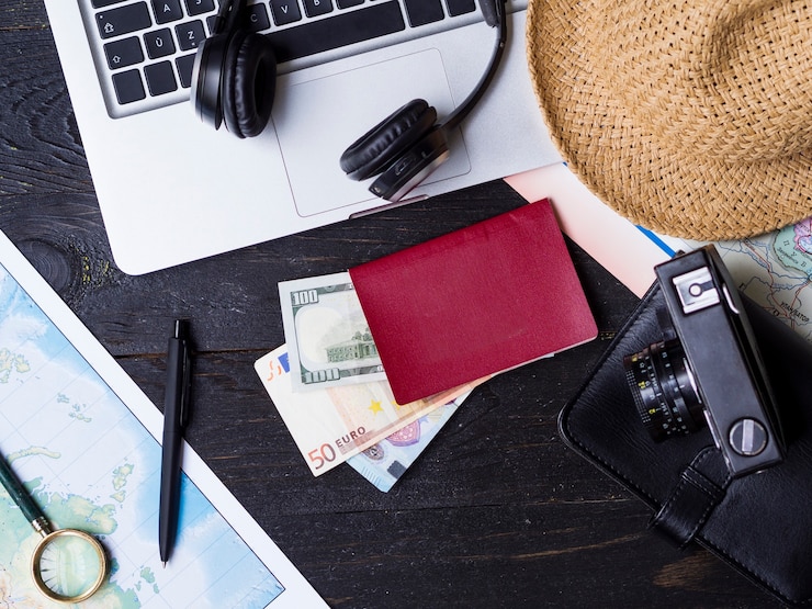 Free Photo top view travelling accessories and money
