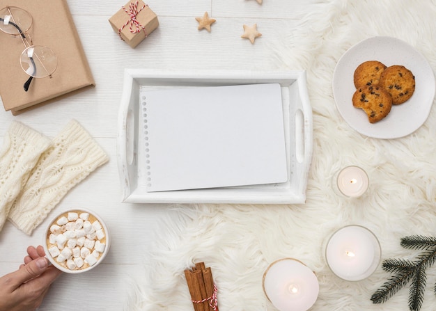 Top view of tray with notebook and cookies