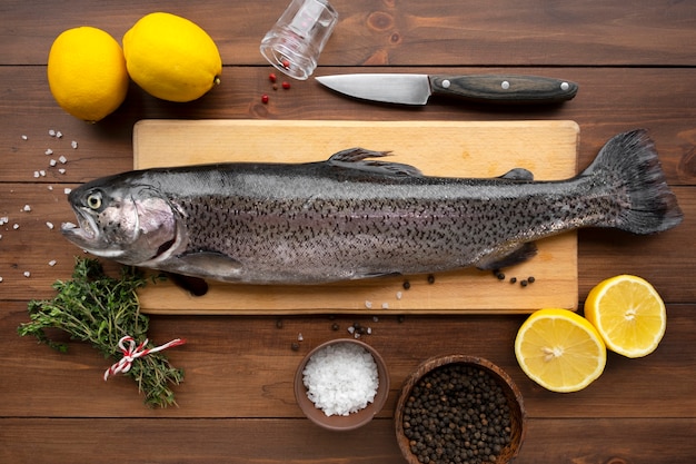 Free photo top view trout ready to be cooked