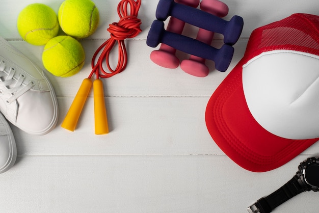 Top view of trucker hat with exercise equipment