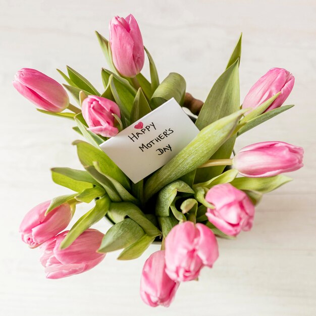 Top view tulips arrangement with card