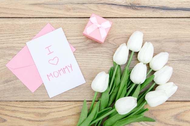 Free photo top view of tulips bouquet on wooden table