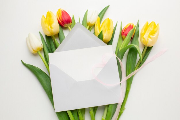 Top view tulips flowers with envelope