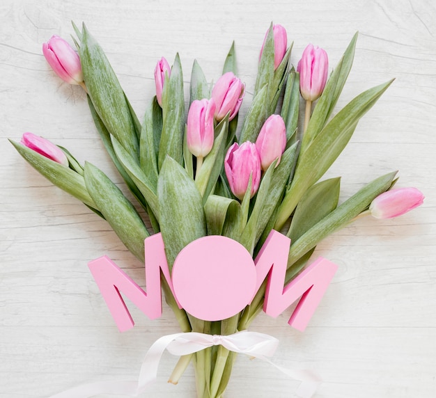 Top view tulips and mom sign