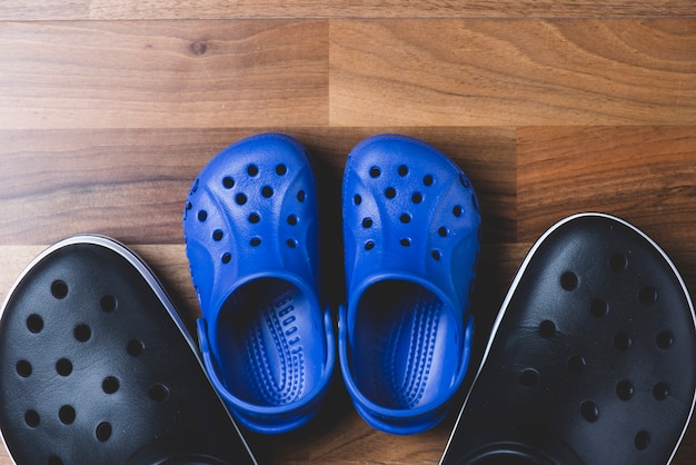 Top view of two pairs of plastic shoes