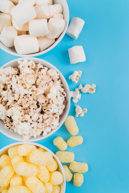 Top view unhealthy snacks bowls