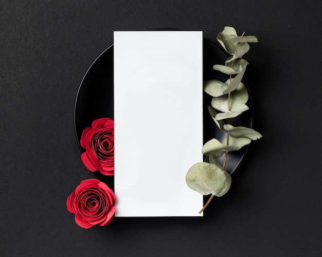 Top view of valentine's day roses with plate and blank card