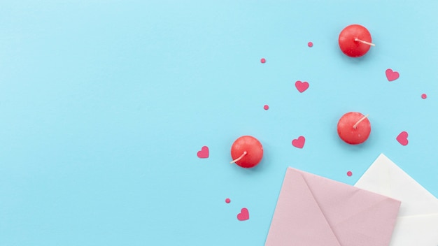 top view of valentines day candles and envelopes