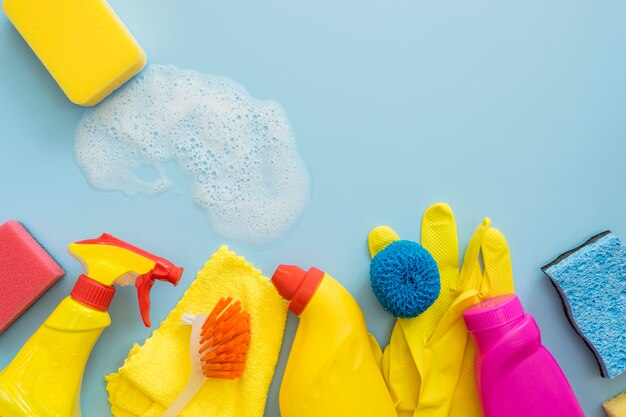 Top view variety of cleaning supplies on the table