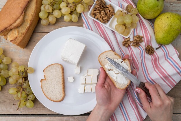 Top view variety of grapes with walnuts and cheese