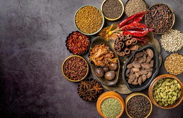 Top view of various Indian spices and seasonings on a table