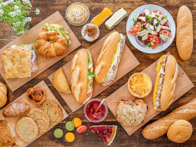 Top view of various tasty dishes on wooden surface