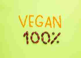 Foto gratuita top view vegan 100% lettering