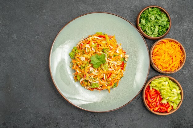 Top view vegetable chicken salad inside plate on grey diet health salad food