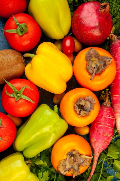 Top view vegetable composition with fresh fruits on a blue table