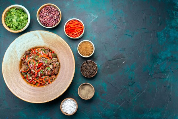 Top view vegetable salad food with greens beans and seasonings on dark-blue background ingredient food vegetable color photo