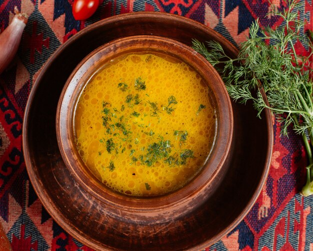 Top view vegetable soup garnished with dill