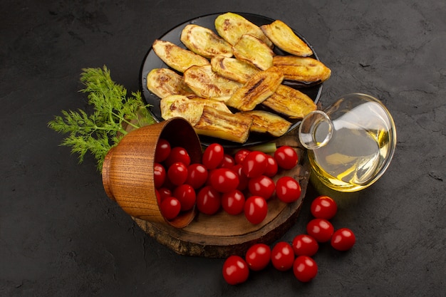 top view vegetables along with cooked eggplant on the dark background