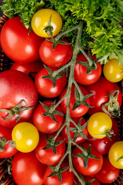 Top view of vegetables as coriander and tomatoes as surface