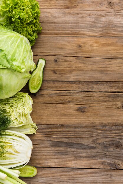 Top view vegetables assortment on wooden background with copy space